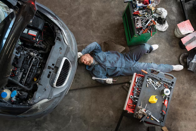 A car mechanic repairing a car